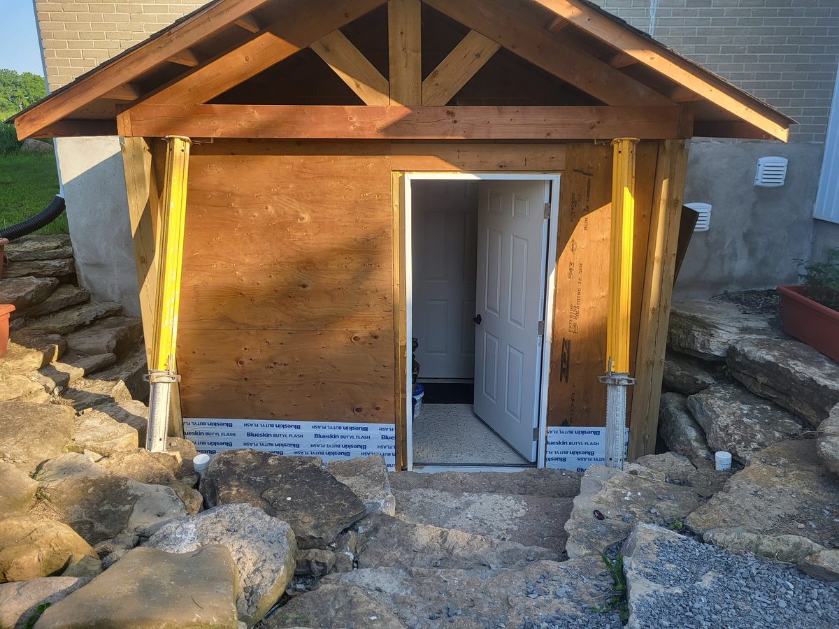 Backfill entrance for wing walls during grading